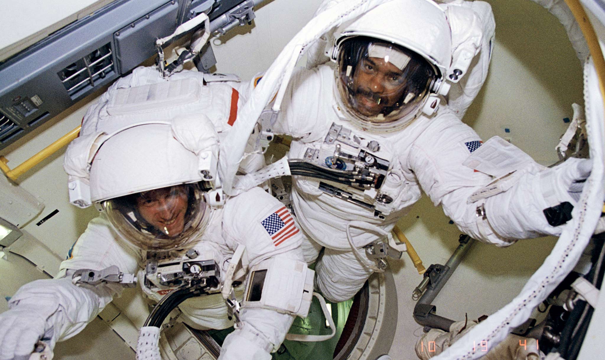 Michael Foale and Harris (right) get ready for their spacewalk.
