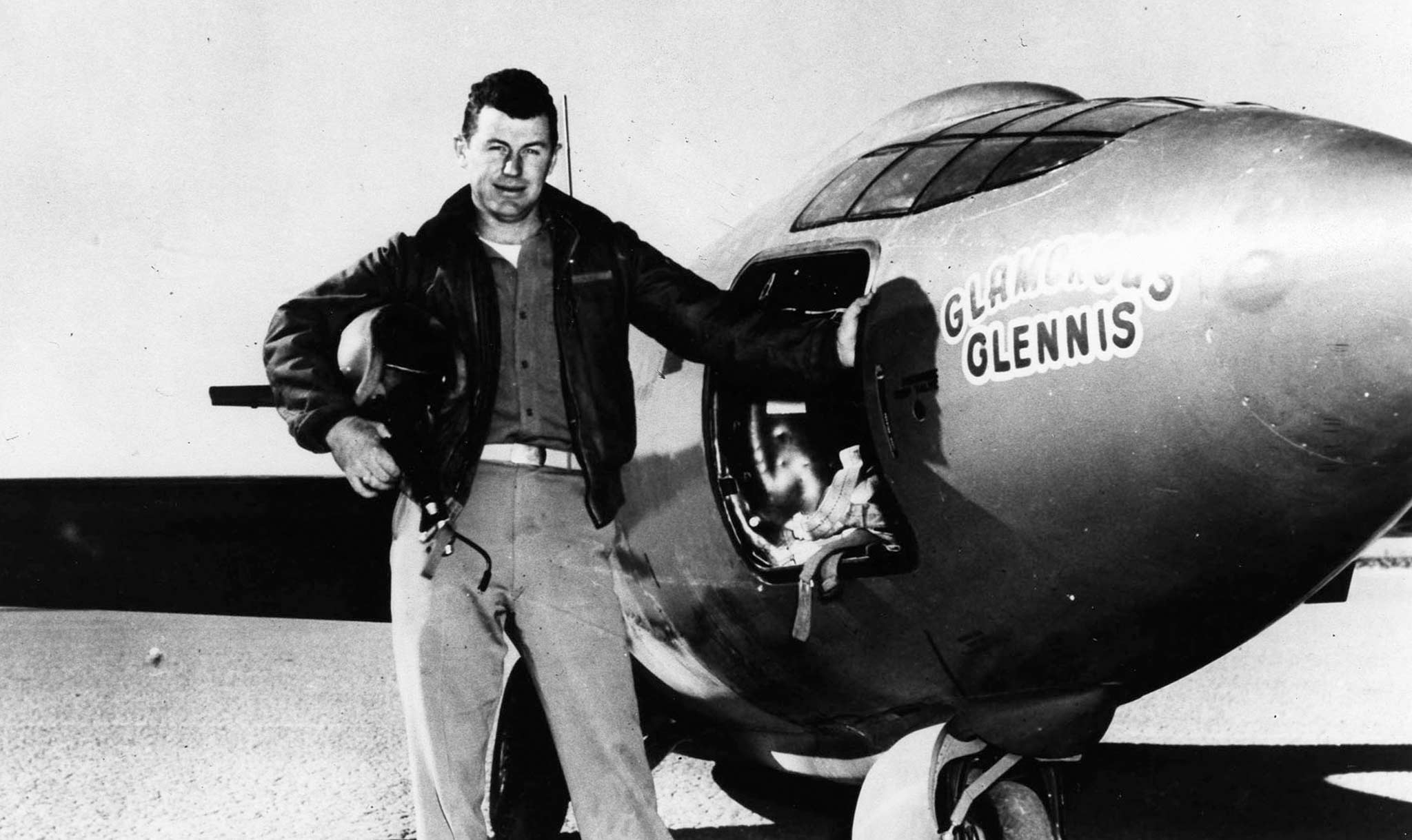 Yeager poses by the X-1 plane, named “Glamorous Glennis.”