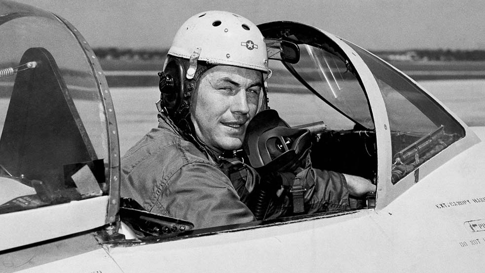 Pilot Chuck Yeager poses in a jet’s cockpit