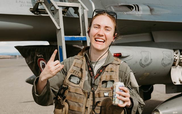 Brittany “Salsa” Dippel shares a smile outside her F-16!