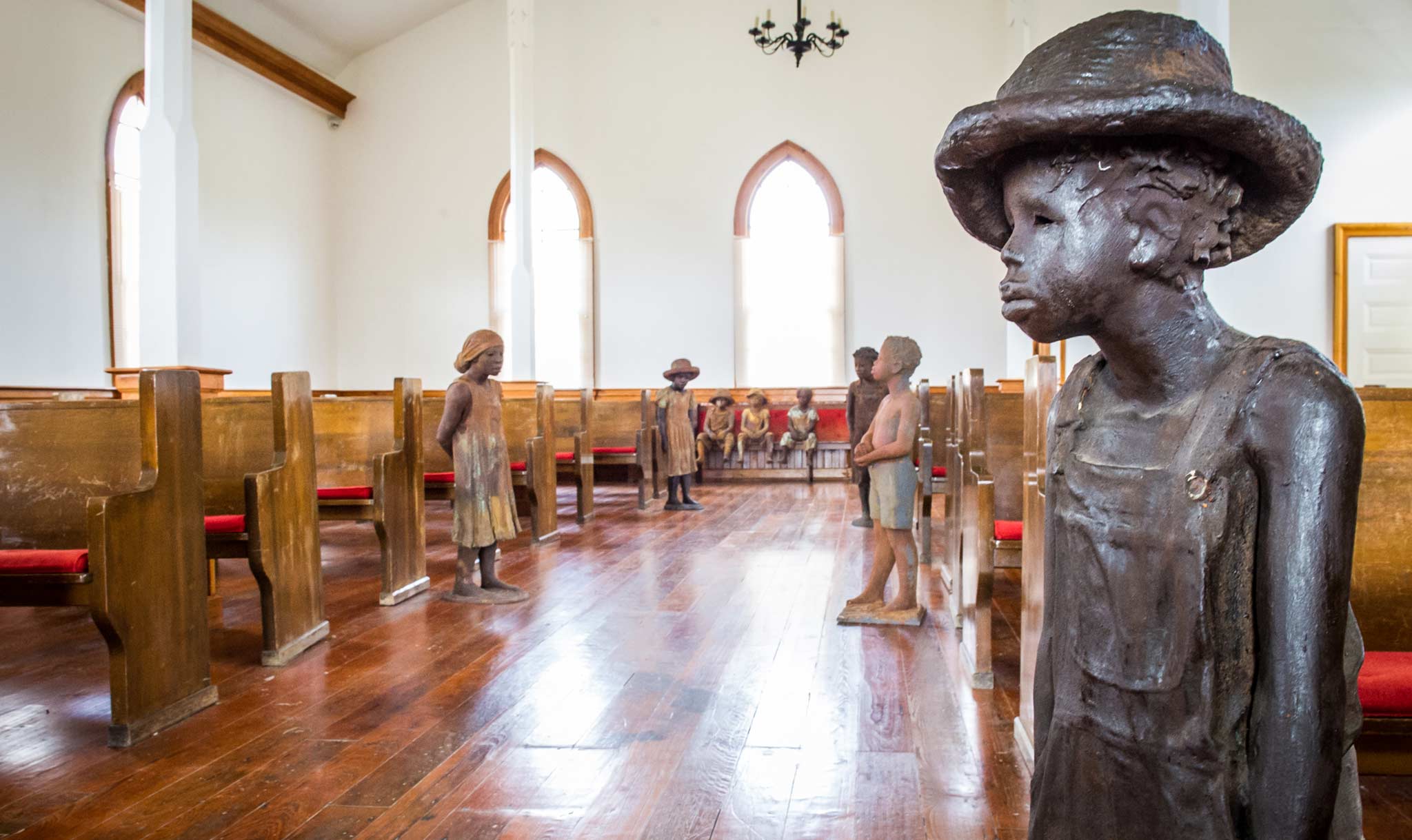 Statues of enslaved children help them connect to the past.