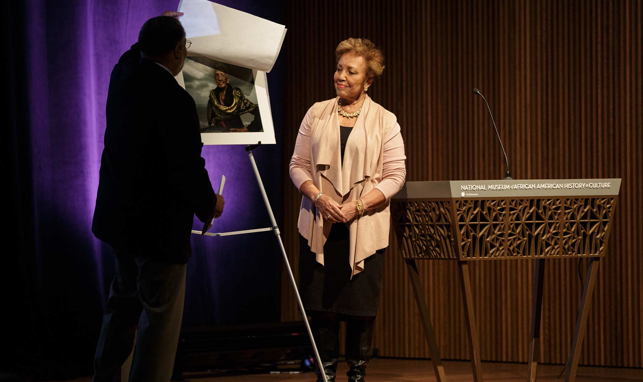 Joylette Hylick smiles by a photograph of her mother.