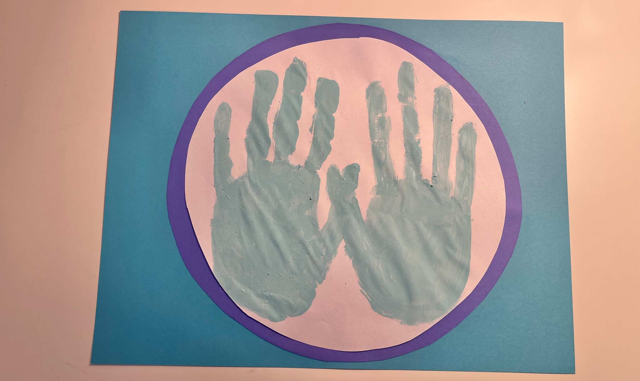 Your painted handprints go in the center.