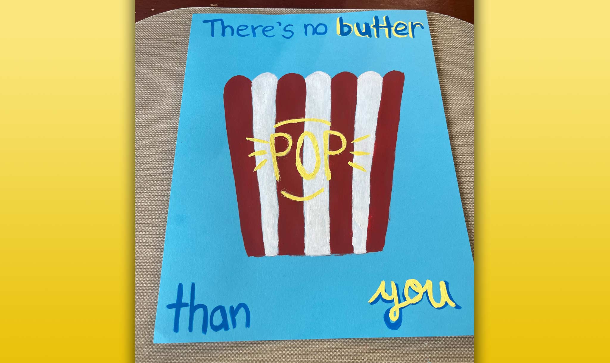 Next, write “Pop” on the bucket.