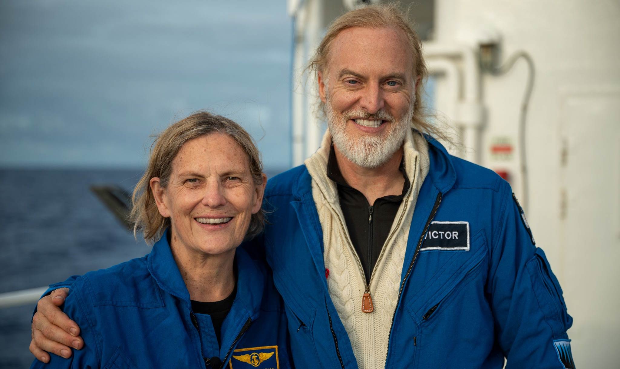 The history-making explorers smile after their return.